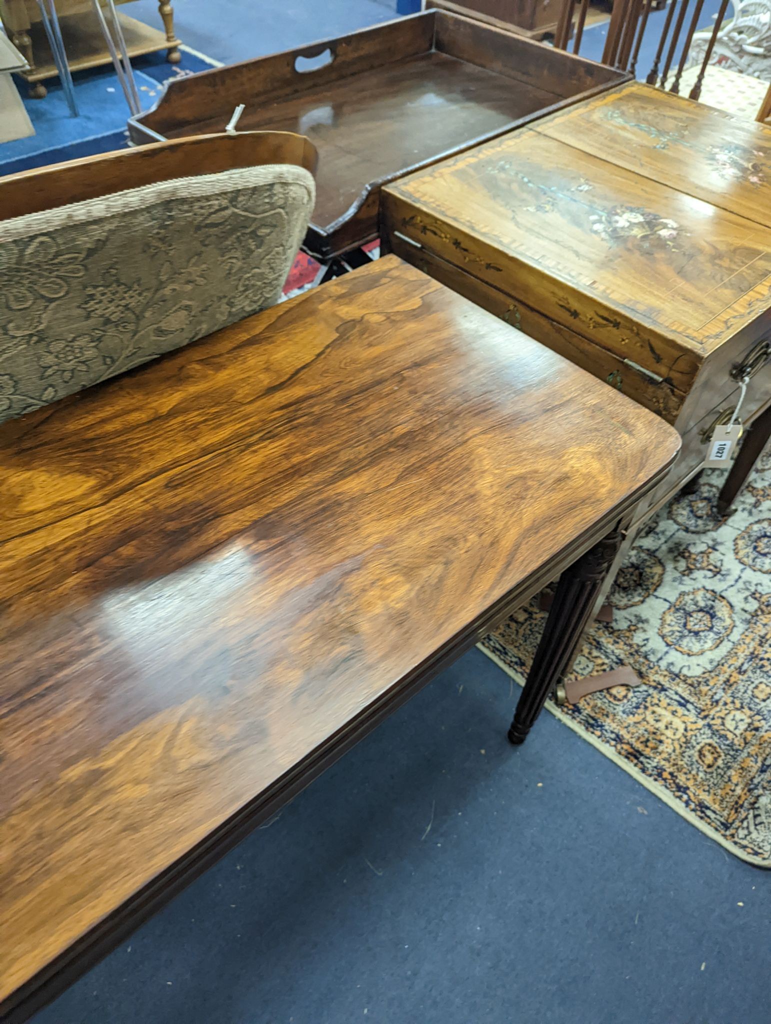 A Regency rosewood brass mounted rectangular folding card table with fluted legs, in the manner of Gillows, width 95cm, depth 47cm, height 75cm